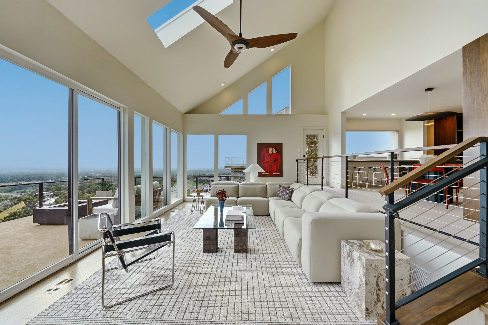 Daylight great room with vaulted ceiling and wall of windows
