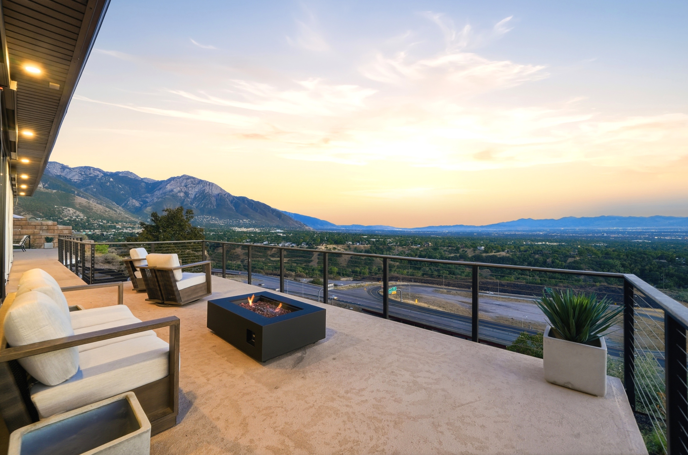 Firepit terrace at twilight with mountain and valley views