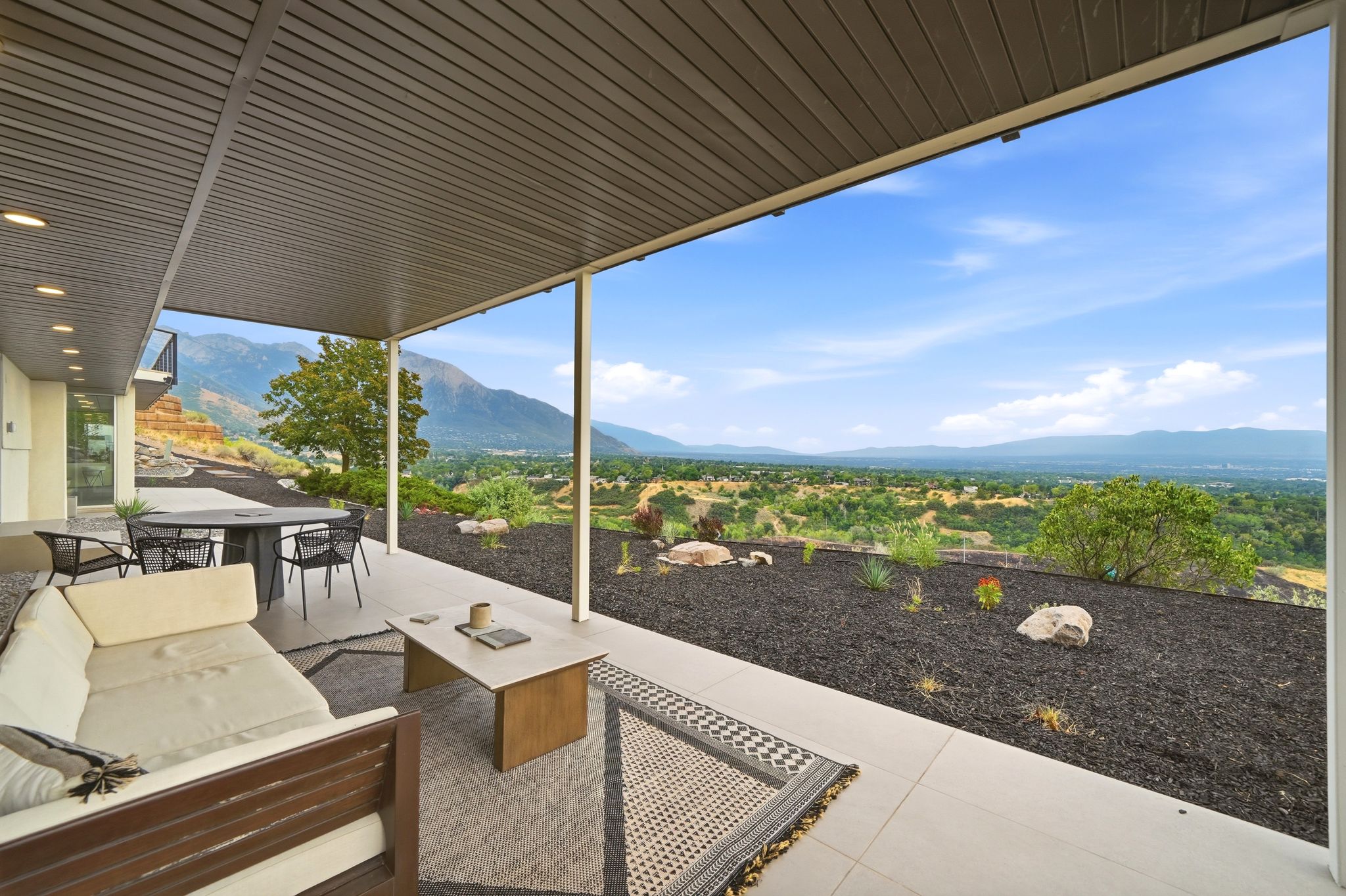 Covered outdoor living area with view