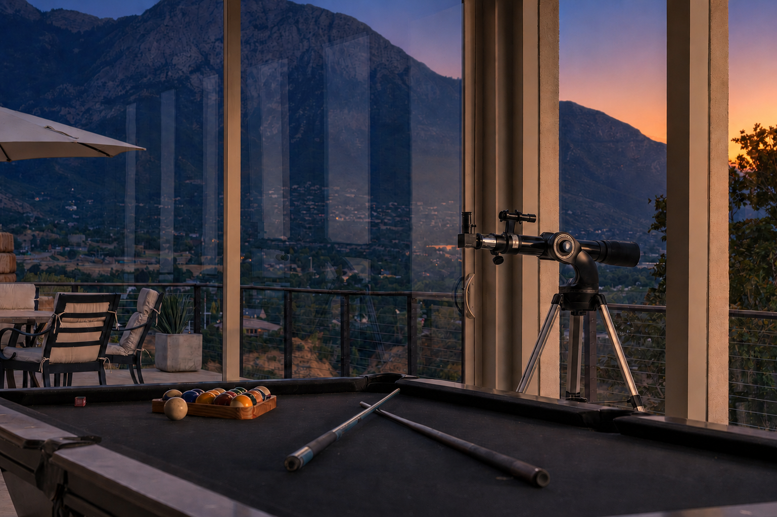 Mountain view through windows near a billiards table